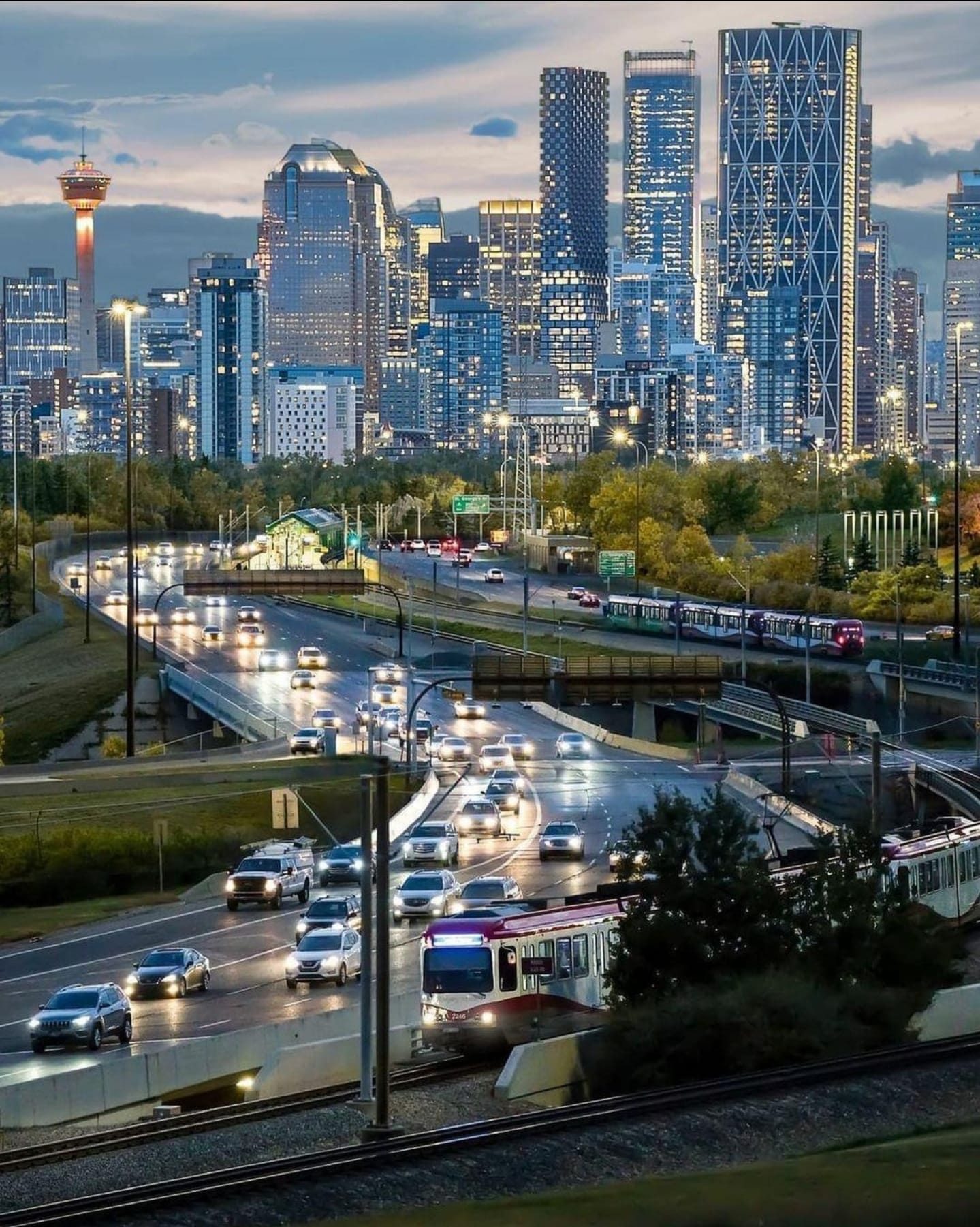 Calgary skyline with LRT train and evening traffic